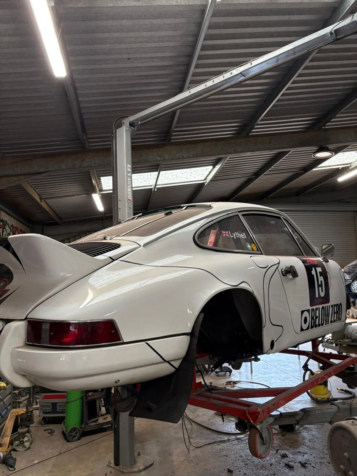 Porsche 911 rally car on workshop lift for welding and structural repair at Ant Fabrications body shop, Banbury